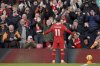 Liverpool's Mohamed Salah celebrates scoring his side's second goal during the English Premier League soccer match between Liverpool and Ipswich Town at Anfield Stadium in Liverpool, Saturday, Jan. 25, 2025.(AP Photo/Ian Hodgson)