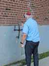 SUPPLIEDAvrom Charach removed more than 100 graffiti symbols or messages, including a swastika on the wall of a Winnipeg synagogue.