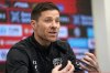 Leverkusen's head coach Xabi Alonso talks to the media during a press conference ahead of the Bundesliga top soccer match between Bayer Leverkusen and Bayern Munich in Leverkusen, Germany, Friday, Feb. 14, 2025. (AP Photo/Martin Meissner)