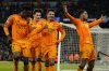 Real Madrid's Jude Bellingham, right, celebrates with teammates after scoring his sides third goal during the Champions League playoff first leg soccer match between Manchester City and Real Madrid at the Etihad Stadium in Manchester, England, Tuesday, Feb. 11, 2025. (AP Photo/Dave Thompson)