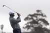 Scottie Scheffler hits a tee shot on the 16th hole of the South Course at Torrey Pines during the second round of the Genesis Invitational golf tournament Friday, Feb. 14, 2025, in San Diego. (AP Photo/Gregory Bull)