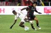 Fullback-wingback Richie Laryea, injured early in last weekend's 4-2 loss in Orlando, will not make the trip with Toronto FC for Saturday's game at FC Cincinnati. Laryea, left, battles for the ball against D.C. United midfielder Hosei Kijima, right, during the first half of an MLS soccer match, Saturday, Feb. 22, 2025, in Washington. THE CANADIAN PRESS/AP/Nick Wass