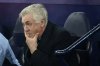 Real Madrid's head coach Carlo Ancelotti grimaces before the start of the Champions League playoff first leg soccer match between Manchester City and Real Madrid at the Etihad Stadium in Manchester, England, Tuesday, Feb. 11, 2025. (AP Photo/Dave Thompson)