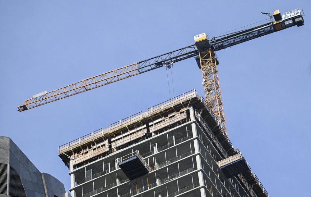 A crane on a building under construction in Montreal, Thursday, November 14, 2024. THE CANADIAN PRESS/Graham Hughes