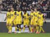 Dortmund's Serhou Guirassy, fifth right, celebrates with his teammates after scoring the opening goal during the German Bundesliga soccer match between FC St. Pauli and Borussia Dortmund in Hamburg, Germany, Saturday, March 1, 2025. (Marcus Brandt/dpa via AP)