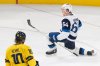 Finland's Mikael Granlund (64) celebrates his winning goal as Sweden's Adrian Kempe (10) looks on during 4 Nations Face-Off overtime hockey action in Montreal on Saturday, Feb. 15, 2025. THE CANADIAN PRESS/Christinne Muschi