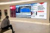A man looks at a large screen showing various financial information in the Scotiabank Plaza Concourse in Toronto on Wednesday Nov. 8, 2017. THE CANADIAN PRESS/Doug Ives
