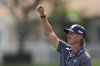 Jake Knapp uses grass to check the wind on the 18th hole during the first round at the Cognizant Classic golf tournament, Thursday, Feb. 27, 2025, in Palm Beach Gardens, Fla. (AP Photo/Rebecca Blackwell)