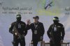 FILE - American-Israeli hostage Keith Siegel, 65, center left, waves as he is escorted by Hamas fighters to be handed over to the Red Cross in Gaza City, Saturday Feb.1, 2025.(AP Photo/Mohammed Hajjar, File)