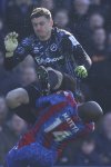 Crystal Palace's Jean-Philippe Mateta is fouled by Millwall goalkeeper Liam Roberts, for which he got a red card, during the English FA Cup soccer match between Crystal Palace and Millwall at Selhurst Park, London, England, Saturday, March 1, 2025. (AP Photo/Ian Walton)