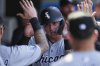 FILE - Chicago White Sox's Korey Lee celebrates in the dugout after scoring during the tenth inning of a baseball game against the Los Angeles Angels in Anaheim, Calif., Wednesday, Sept. 18, 2024. (AP Photo/Ashley Landis, File)