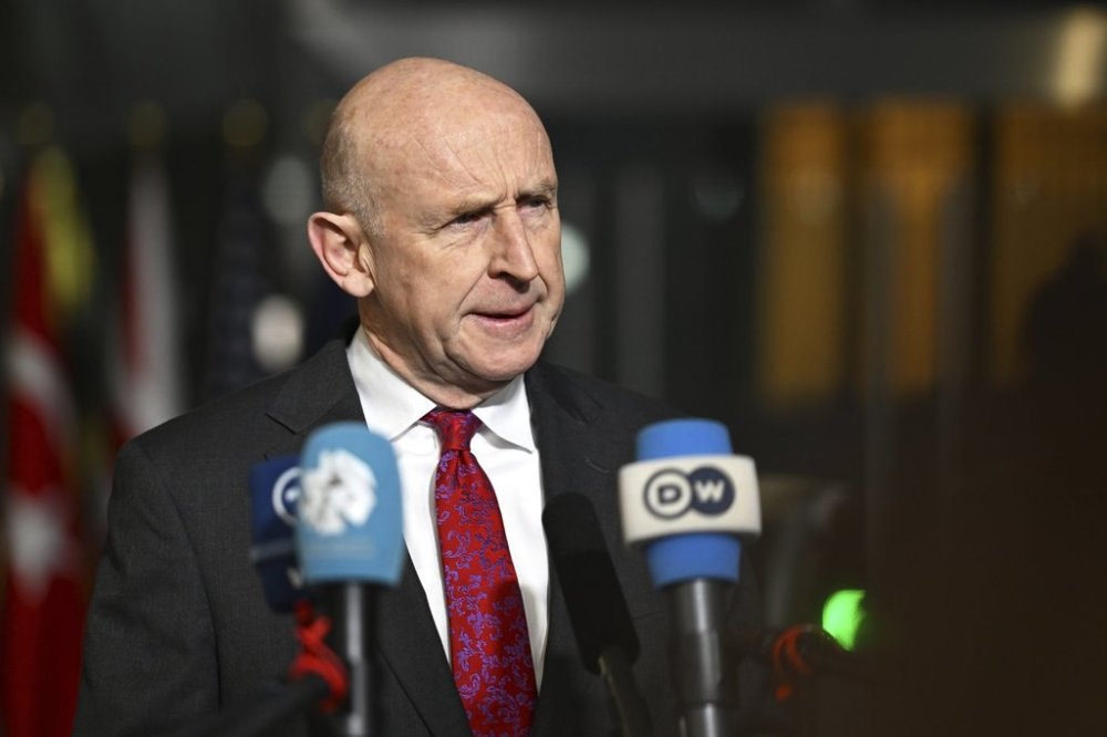 Britain's Defense Secretary John Healey speaks with the media as he arrives for a meeting of NATO defense ministers at NATO headquarters in Brussels, Thursday, Feb. 13, 2025. (AP Photo/Harry Nakos)