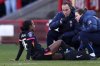 Chelsea's Naomi Girma receives treatment before being substituted during the Barclays Women's Super League match at the Broadfield Stadium, Brighton and Hove, England, Sunday, March 2, 2025. (John Walton/PA via AP)