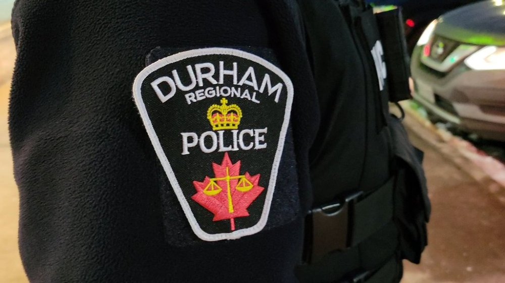 A Durham Regional Police officer's logo emblem is shown at a Bowmanville, Ont. shopping centre parking lot on Tuesday Feb. 28, 2023. THE CANADIAN PRESS/Doug Ives