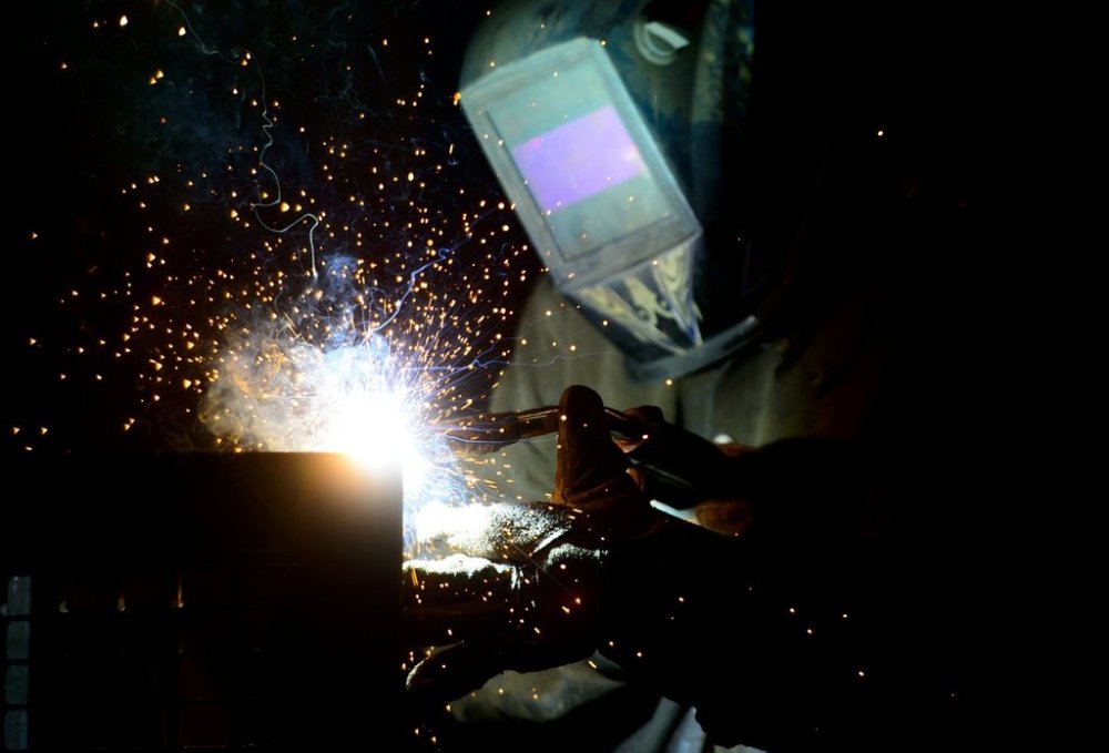 A welder fabricates a steel structure at an iron works facility in Ottawa on Monday, March 5, 2018. The Canadian Labour Congress (CLC) is hosting an emergency meeting tonight to discuss the impact of tariffs on workers and communities. THE CANADIAN PRESS/Sean Kilpatrick