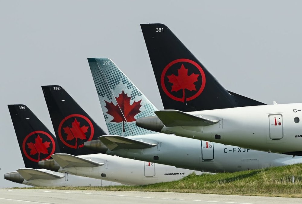 Air Canada planes sit on the tarmac at Pearson International Airport Toronto on Wednesday, April 28, 2021. THE CANADIAN PRESS/Nathan Denette