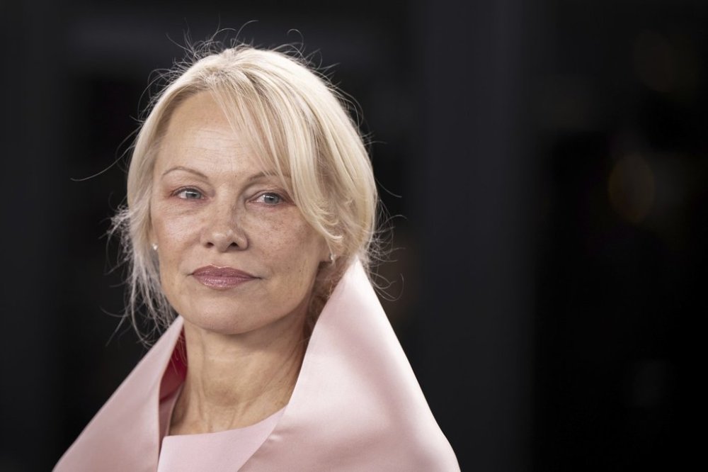 Pamela Anderson poses on the Green Carpet before the screening of her movie