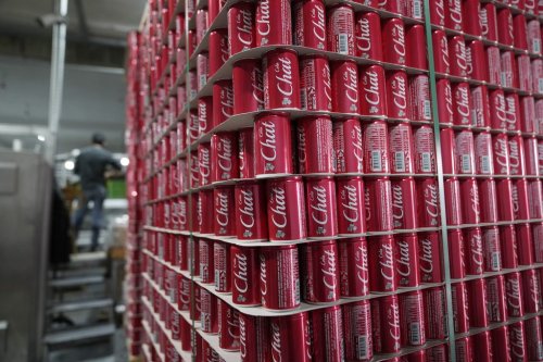 Pallets of branded aluminum cans at the production line in the Palestinian Chat Cola bottling plant, in the West Bank city of Salfit, Feb. 13, 2025. (AP Photo/Nasser Nasser)