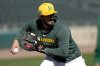 Athletics' Shea Langeliers throws during a spring training baseball workout, Friday, Feb. 21, 2025, in Mesa, Ariz. (AP Photo/Matt York)