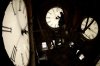 FILE - Custodian Ray Keen inspects a clock face before changing the time on the 100-year-old clock atop the Clay County Courthouse, March 8, 2014, in Clay Center, Kansas. (AP Photo/Charlie Riedel, File)