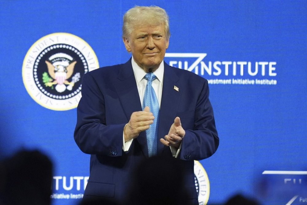 President Donald Trump arrives to speak at the Future Investment Initiative (FII) Institute summit in Miami Beach, Fla., Wednesday, Feb. 19, 2025. THE CANADIAN PRESS/AP-Rebecca Blackwell