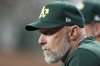 FILE - Oakland Athletics manager Mark Kotsay watches the action on the field during the ninth inning of a baseball game against the Arizona Diamondbacks, June 29, 2024, in Phoenix. (AP Photo/Ross D. Franklin, file)