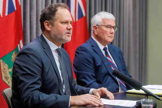 Justice Minister Matt Wiebe (left) with Garth Smorang, the lawyer hired to lead the inquiry. (Mike Deal / Free Press)
