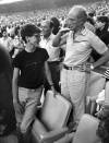 Paul Chiasson / The Canadian Press
                                Former prime minister Pierre Trudeau also faced capricious economic policies from an American president. Here, he spends time with his eldest son Justin during a Montreal Expos game in Montreal in 1987.