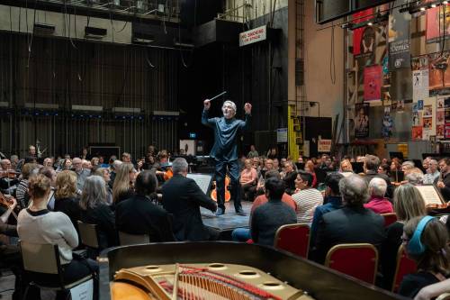 MARK RASH PHOTO WSO
                                Maestro Daniel Raiskin conducts amid the WSO players and the audience on Thurday night.