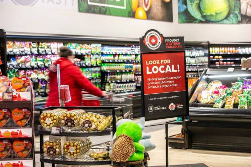 MIKAELA MACKENZIE / FREE PRESS
                                A sign encouraging shoppers to buy locally produced products at the St. Vital Co-op on Monday, Feb. 3, 2025. For story. Winnipeg Free Press 2025