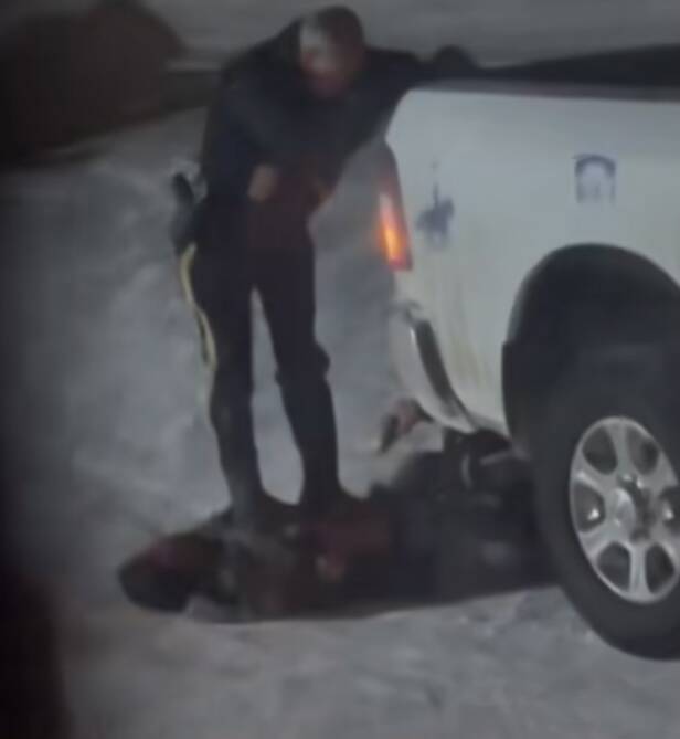 An image from a short video posted by TikTok user @katch_x shows an RCMP officer standing on a man’s chest while holding the rear of an RCMP pickup truck. The man was arrested in Mosakahiken Cree Nation early Friday. RCMP said Monday the man resisted arrest and struggled with officers.