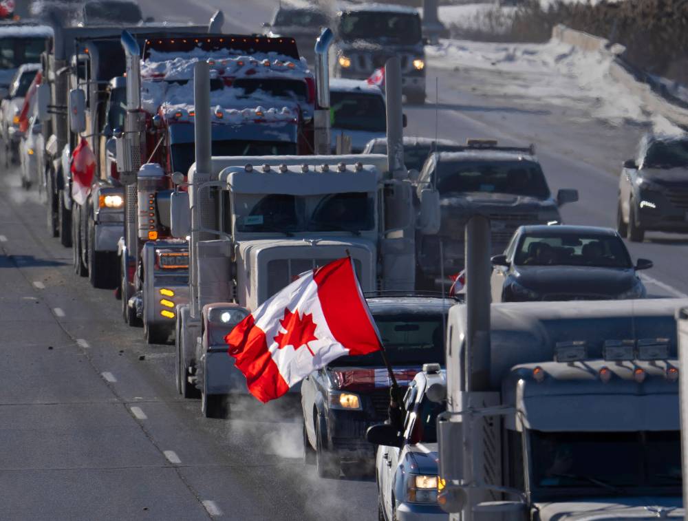 Frank Gunn / Canadian Press files
In this 2022 photo, a convoy of truckers protesting measures taken to curb the spread of COVID-19 drive to Parliament Hill in Ottawa.