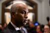 Minister of International Development Ahmed Hussen listens to questions from journalists as he arrives for a meeting of the Liberal Caucus on Parliament Hill in Ottawa, on Wednesday, Feb. 14, 2024. (Justin Tang / The Canadian Press files)