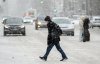 A person crosses a street as snow falls in Montreal, Sunday, January 7, 2024. Much of southern Ontario and Quebec is under winter storm and snowfall warnings as a low-pressure system moves east toward the Atlantic provinces. THE CANADIAN PRESS/Graham Hughes