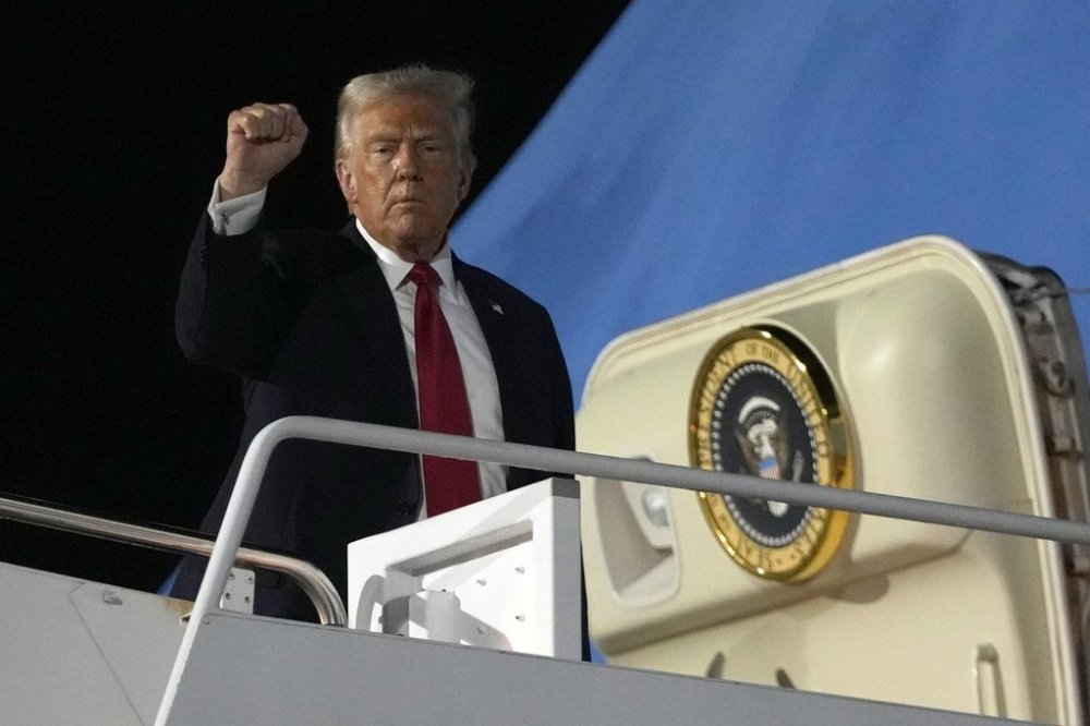 President Donald Trump boards Air Force One at the Naval Air Station Joint Reserve Base in New Orleans, Sunday, Feb. 9, 2025. (AP Photo/Ben Curtis)