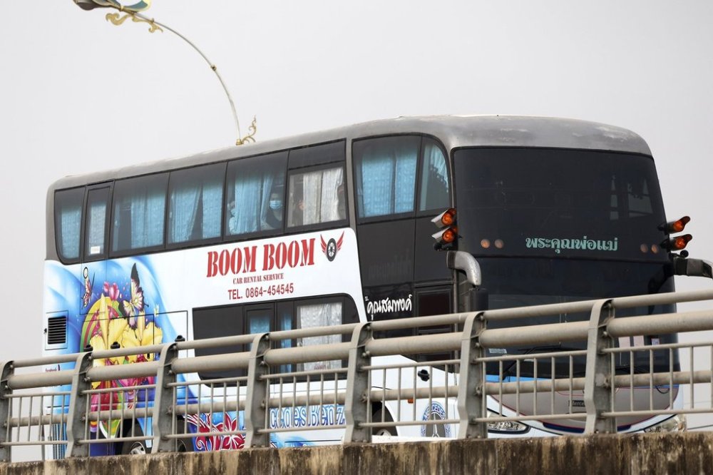 A bus, believed to be carrying Chinese nationals who have worked at scam centers in eastern Myanmar, crosses the 2nd Thai-Myanmar Friendship Bridge in Mae Sot in Thailand's Tak province before being flown back to China on Thursday, Feb. 20, 2025. (AP Photo/Sarot Meksophawannakul)