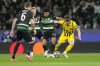 Dortmund's Marcel Sabitzer, right, challenges for the ball with Sporting's Joao Simoes during the Champions League playoff first leg soccer match between Sporting CP and Borussia Dortmund at the Alvalade stadium in Lisbon, Portugal, Tuesday, Feb. 11, 2025. (AP Photo/Armando Franca)