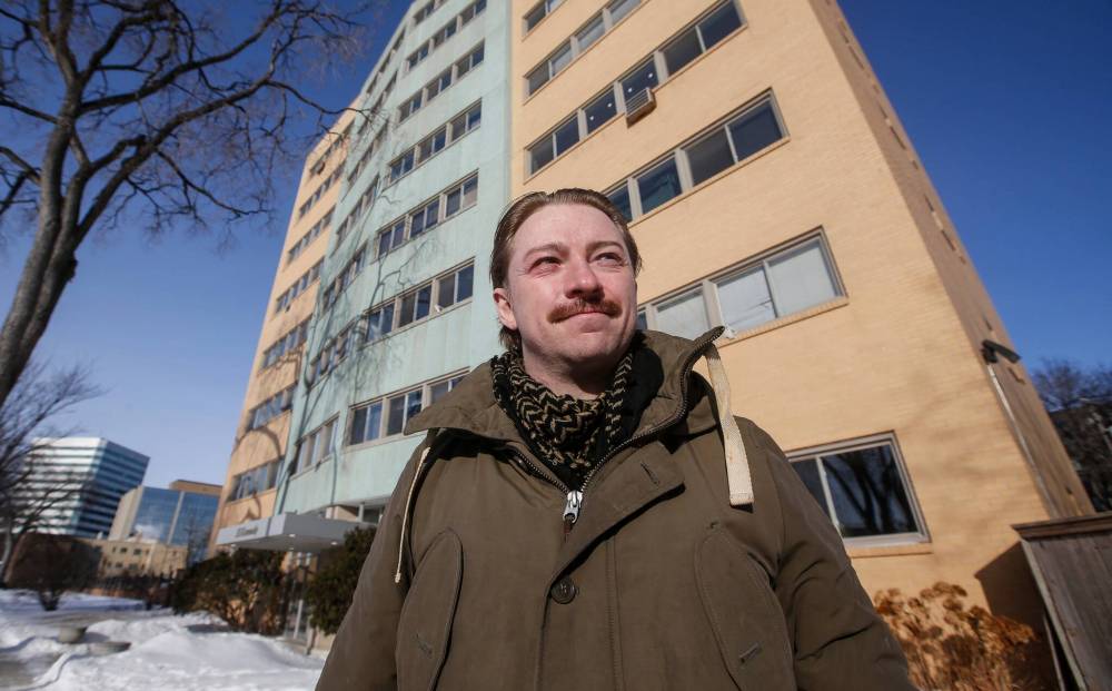 JOHN WOODS / FREE PRESS
Ryan Simmons outside his downtown apartment building where he says rent nearly doubled the last two years after unnecessary renovations.
