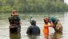 The Brandon Sun files
                                Parks Canada employees conduct visual inspections for signs of zebra mussels near Boat Cove at Clear Lake in July, 2024.