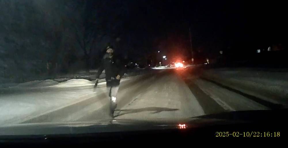 SUPPLIED
                                Video still shows a machete-wielding man approach a vehicle driving along King Edward Street near Hunt Avenue in Tyndall Park Monday night.