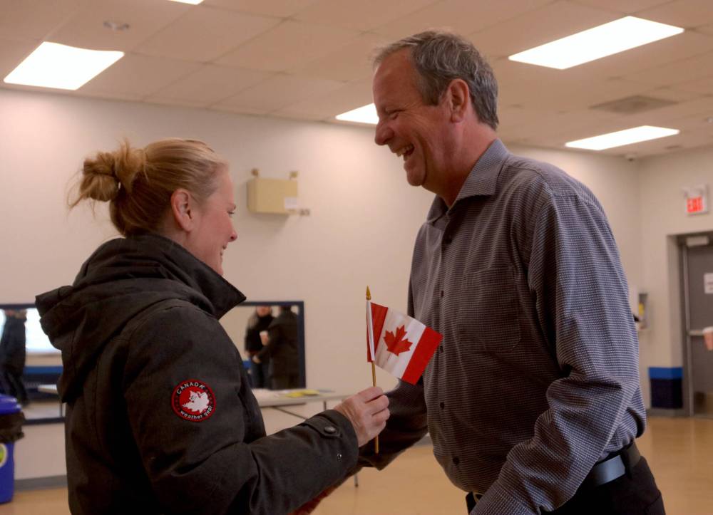NICOLE BUFFIE / FREE PRESS
Coun. John Orlikow marked Flag Day with a Canadian flag giveaway in his constituency on Saturday afternoon. All 100 flags he bought were gone in the first 10 minutes.