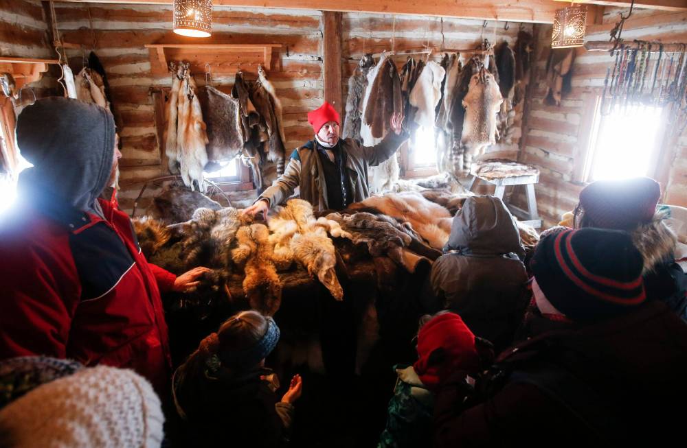 Visitors check out the trading post and learn about the fur trade. (John Woods / Free Press)