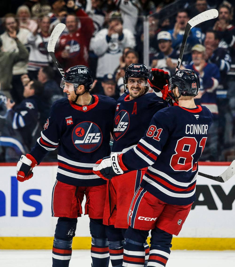 JOHN WOODS / THE CANADIAN PRESS FILES
Gabriel Vilardi (left), Mark Scheifele (centre) and Kyle Connor celebrate after Vilardi scored against the New York Islanders in the team’s final game before the 4 Nations Face-Off.