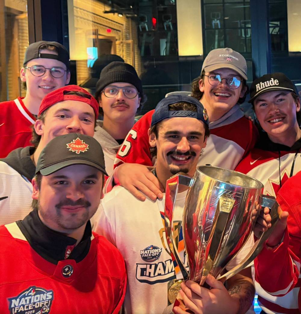 SUPPLIED
Team Canada forward Seth Jarvis, holding the 4 Nations Face-Off’s championship trophy, with friends Bryan Hanna (back row, left to right), Sloan Tremblay, Lucas Fry and Matt McLeod, and Lucas Humble (middle left), and his brother Kayden (front left).