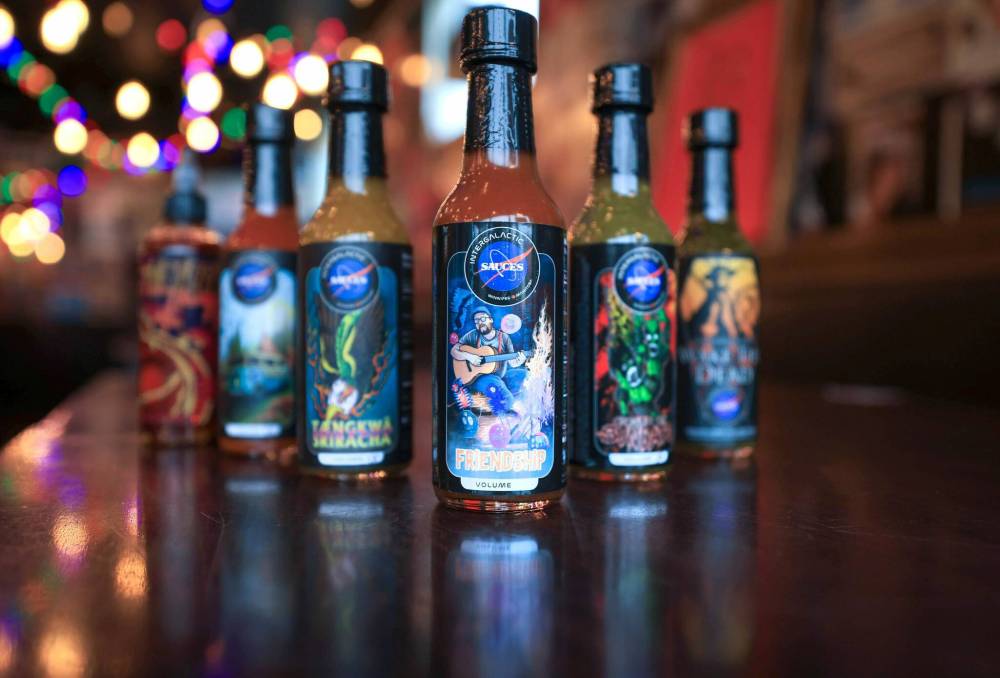 RUTH BONNEVILLE / FREE PRESS
In addition to its
core range of
products, Intergalactic Sauces
commonly
partners up
with others to
produce one-off
sauces, often
for charitable
purposes.