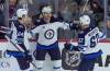 Adrian Wyld / The Canadian Press
                                Winnipeg Jets centre Mason Appleton (centre) celebrates his goal against the Ottawa Senators with teammates Logan Stanley (left) and Nino Niederreiter (right) in the first, Wednesday in Ottawa.