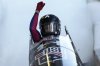 Kaysha Love, of the United States, celebrates as she finishes her second run in the women's monobob at the Bobsleigh World Cup in Innsbruck, Austria, Saturday, Jan. 18, 2025. (AP Photo/Matthias Schrader)