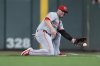 FILE - Cincinnati Reds first baseman Ty France (2) fields a groundout hit by Minnesota Twins' Brooks Lee during the sixth inning of a baseball game Saturday, Sept. 14, 2024, in Minneapolis. (AP Photo/Abbie Parr, File)