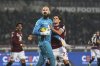 Torino's goalkeeper Vanja Milinkovic-Savic and Torino's Samuele Ricci celebrates after saving a penality during the Italian Serie A soccer match between Torino and AC Milan the Stadio Olimpico Grande Torino in Turin, north west Italy, Saturday, Feb. 22, 2025. (Alberto Gandolfo/LaPresse via AP)