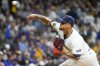 FILE - Milwaukee Brewers pitcher Frankie Montas throws during the first inning of Game 2 of a National League wild card baseball game against the New York Mets, Oct. 2, 2024, in Milwaukee. (AP Photo/Morry Gash, file)